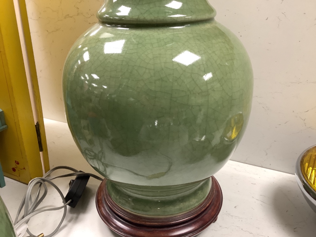 A pair of Chinese celadon crackle glazed table lamps, height 46cm excluding light fitting